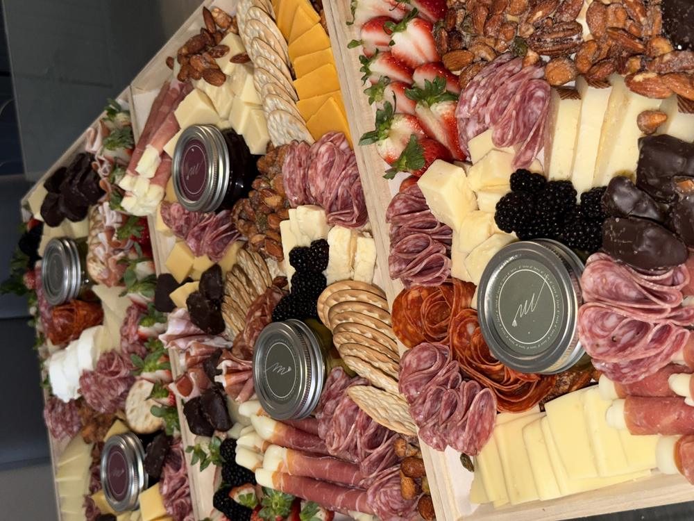 Several Miora Cheese boards prepared together for a catering order