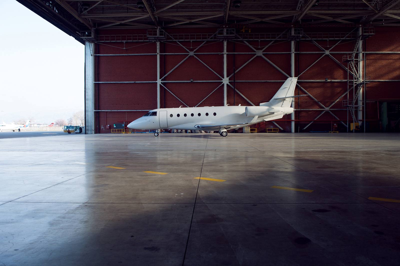 Private jet in a hangar awaiting departure catering