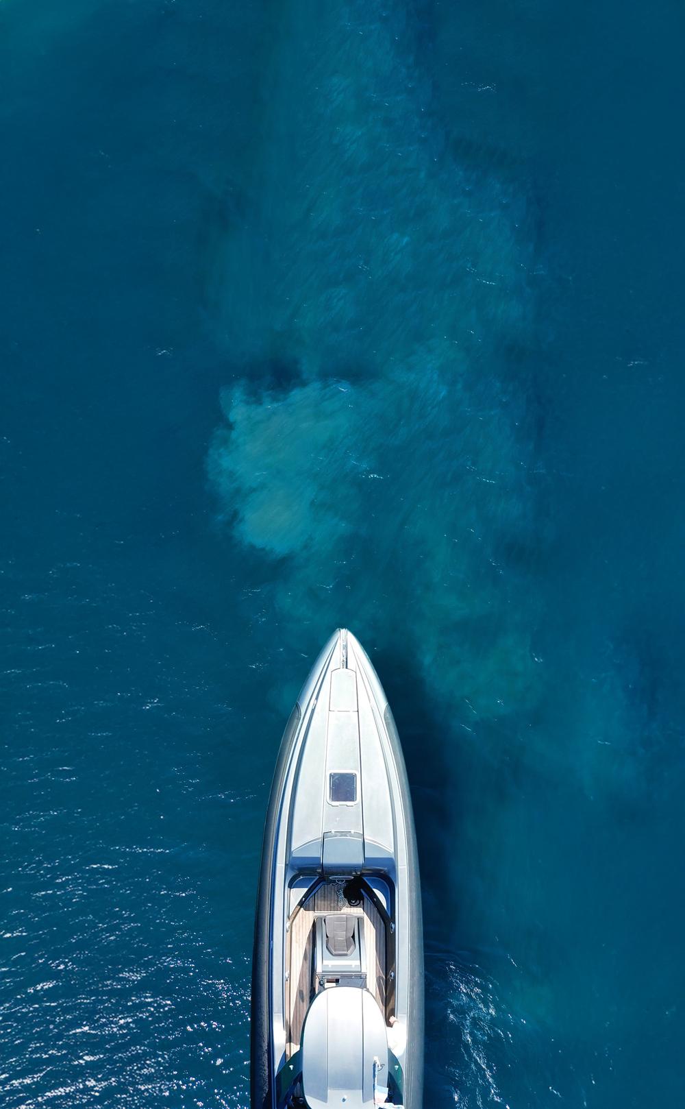 Yacht cruising through clear blue water